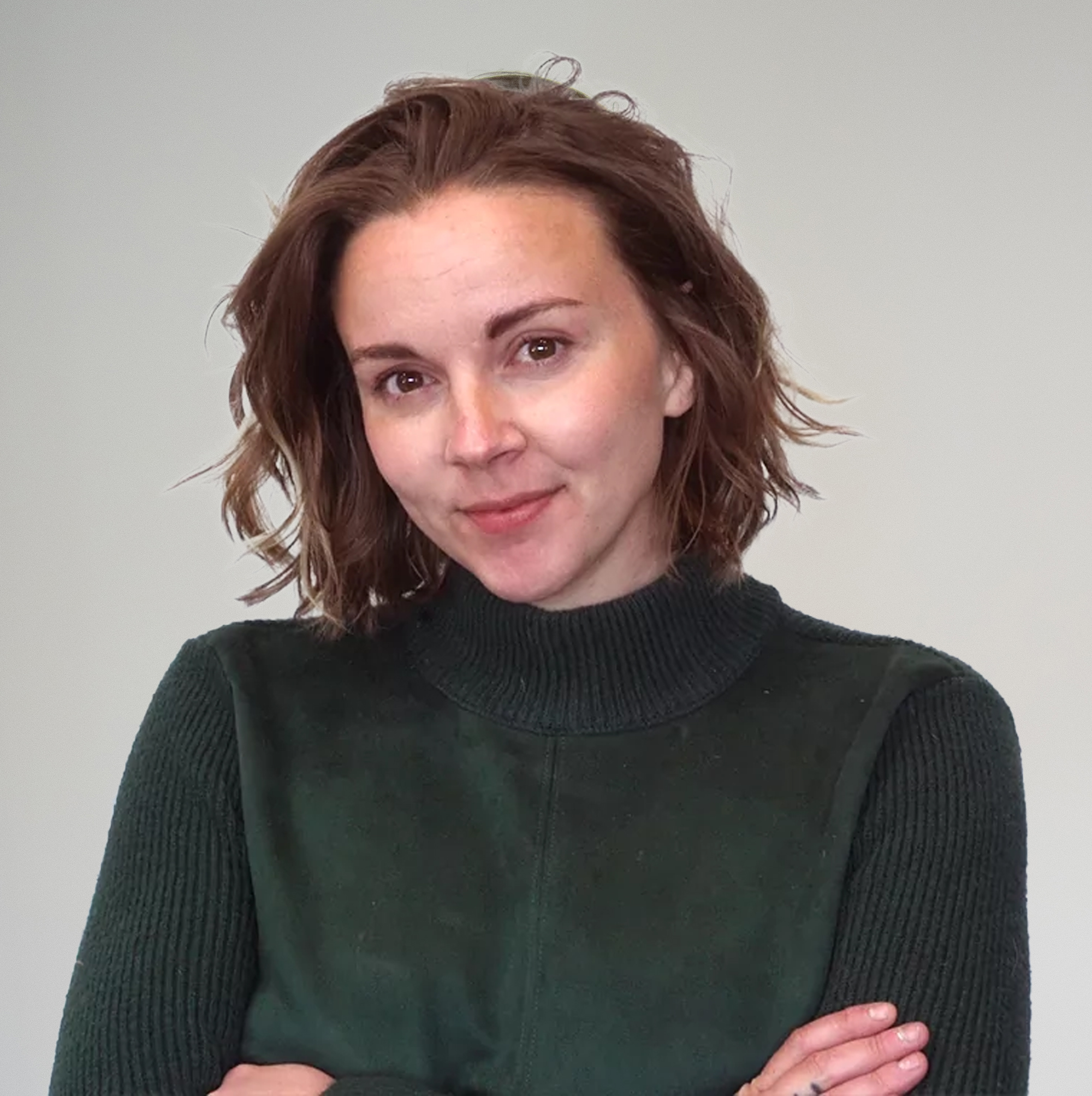 Professional headshot of female team member with short hair