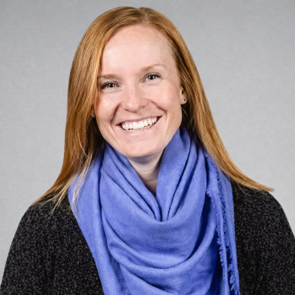Professional headshot of female team member with scarf